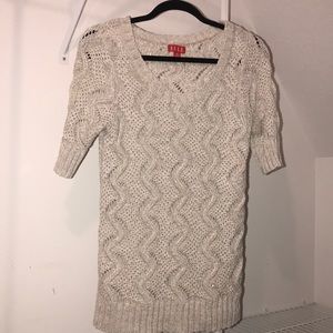 Beige sweater with light metallic accents